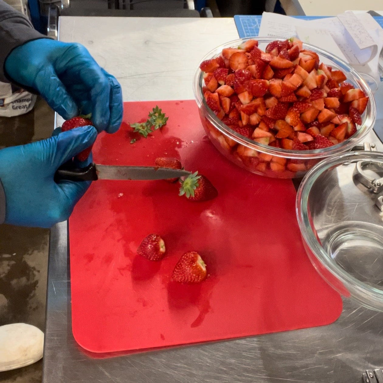 Fresh strawberries cut by hand to make our strawberries and cream flavour sparkling tea kombucha drink in time for Wimbledon