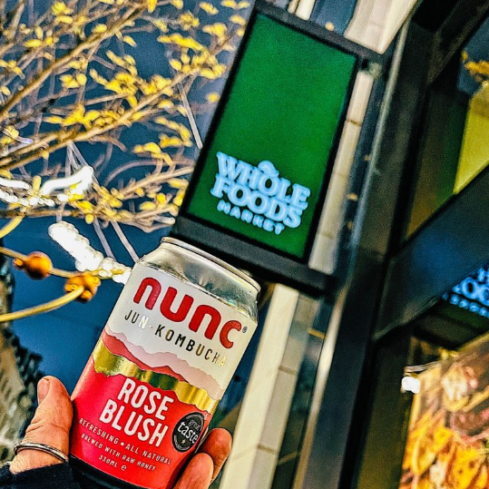 A gorgeous can of non-alcoholic Rose Blush kombucha outside the Whole Foods Market store in Piccadilly London